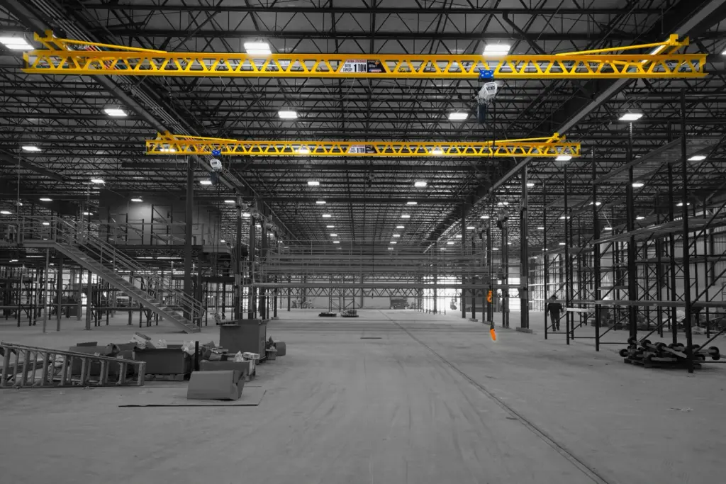 Ceiling mounted 1 ton cranes in factory.