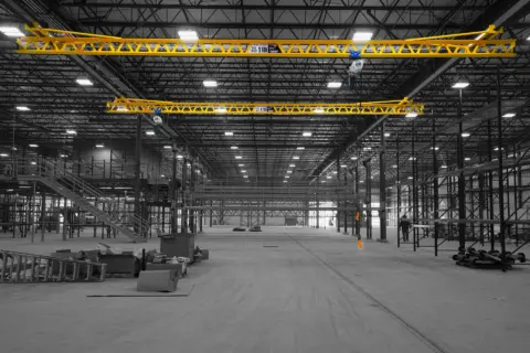 Ceiling mounted 1 ton cranes in factory.